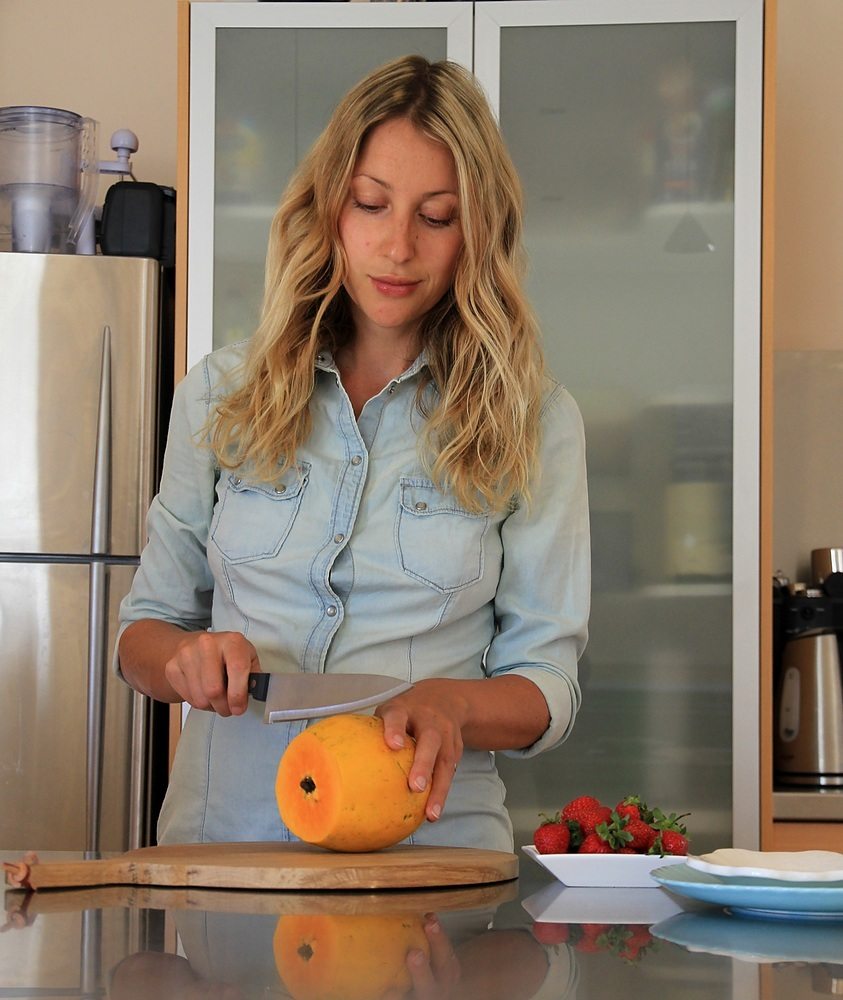 woman cut papaya