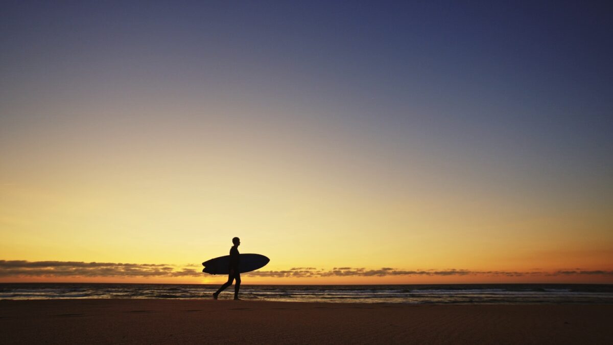 A surfer at sunset