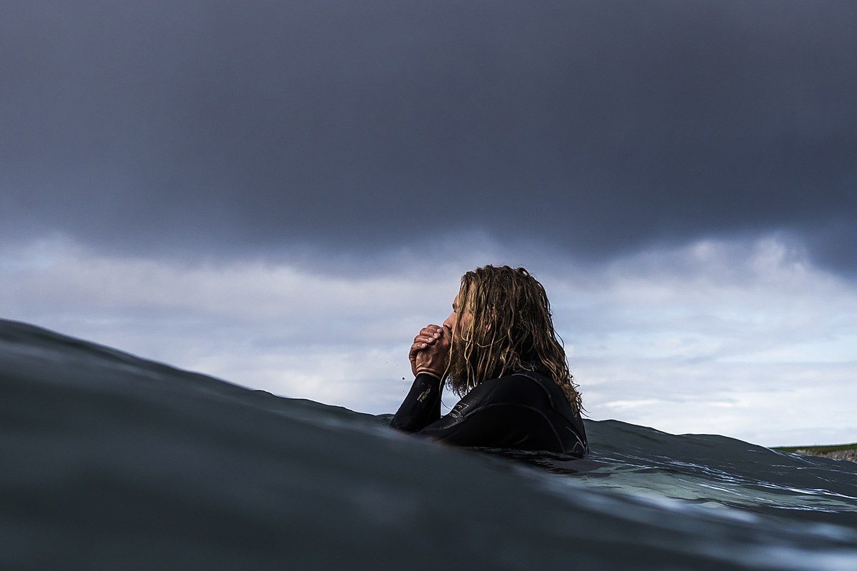 cold surfer in the water