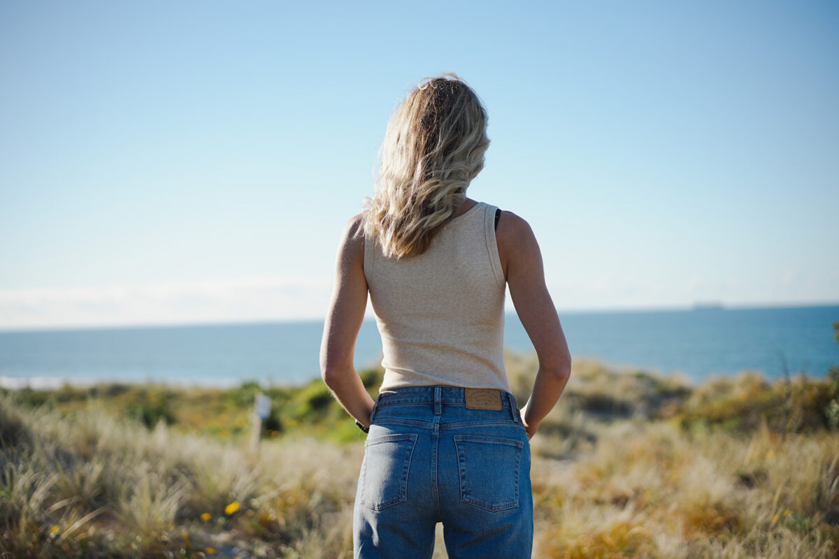 Geniya wearing the Outerknown Sojourn Ribbed Tank, showing the ribbed texture and scoop neck